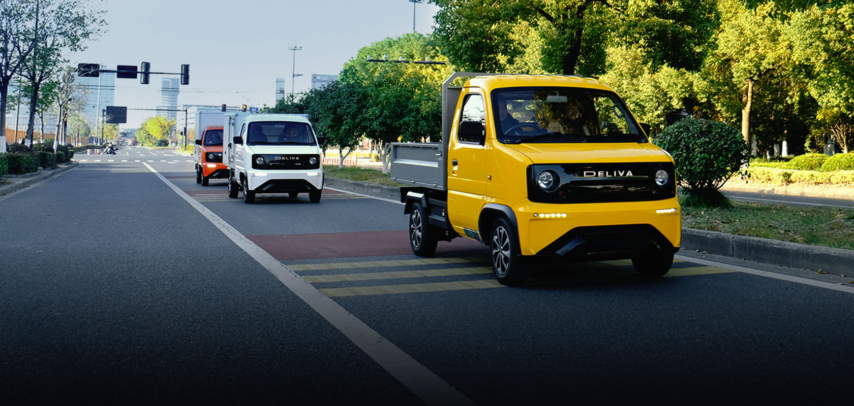 A fleet shot of the different variants of Deliva, an all electric cargo van from One Moto